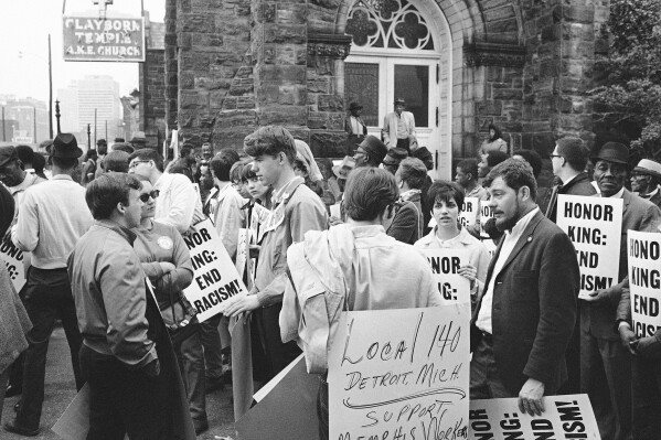 In this April 8, 1968, file photo, people gather at the Clayborn Temple as they prepare to march in honor of Dr. Martin Luther King in Memphis, Tenn., four days after the civil rights leader was assassinated. (AP Photo/File)