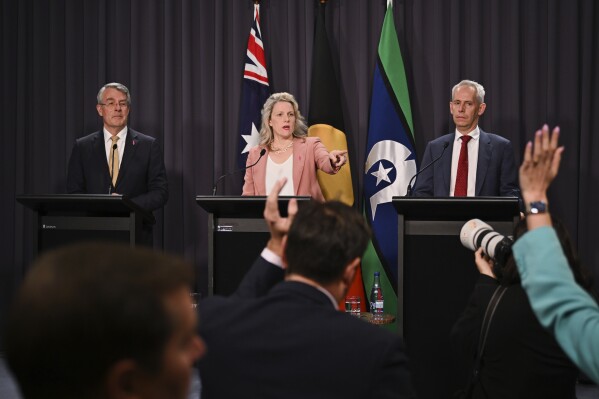 From left, Australian Attorney-General Mark Dreyfus, Australian Home Affairs Minister Clare O'Neil and Australian Immigration Minister Andrew Giles answer questions during a press conference at Parliament House in Canberra, Australia, Wednesday, Dec. 6, 2023. The Australian government hopes to rush legislation through Parliament on Wednesday that could place behind bars some of the migrants freed after the High Court ruled their indefinite detention was unconstitutional. (Lukas Coch/AAP Image via AP)