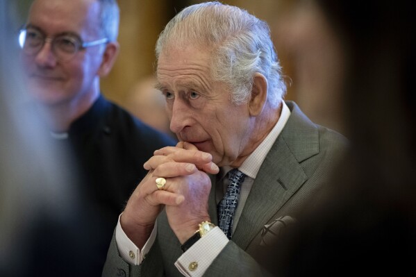 FILE - Britain's King Charles III hosts a gathering of young UK community and faith leaders to discuss the challenges their communities face, at Buckingham Palace, in London, Wednesday, Dec. 13, 2023. Buckingham Palace says King Charles III will undergo a “corrective procedure” next week for an enlarged prostate. (Aaron Chown/Pool Photo via AP, File)