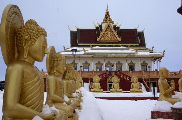 The Buddhist temple of Watt Munisotaram is seen on snow-covered farmland in Hampton, Minn., on Saturday, Feb. 4, 2023. Started by Cambodian refugees who had fled the Khmer Rouge's killing fields four decades ago, it's evolved into a 40-acre complex whose community is seeking to strengthen ties with younger generations. (AP Photo/Giovanna Dell'Orto)