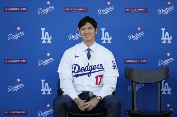 Los Angeles Dodgers' Shohei Ohtani answers questions during a baseball news conference at Dodger Stadium Thursday, Dec. 14, 2023, in Los Angeles. (AP Photo/Ashley Landis)
