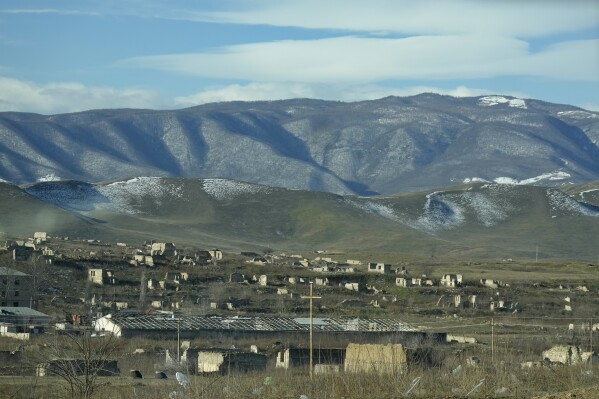 A view of ruins on the outskirts of Fuzuli at liberated from the occupied district of Fuzuli of Azerbaijan, Wednesday, Feb. 7, 2024. Azerbaijanis are voting Wednesday in an election almost certain to see incumbent President Ilhan Aliyev chosen to serve another seven-year term. (AP Photo/Sergei Grits)