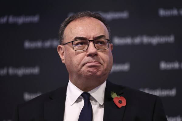 Governor of the Bank of England Andrew Bailey arrives to address the media during a press conference concerning interest rates, at the Bank of England, in London, Thursday, Nov. 2, 2023. The Bank of England kept its main interest rate unchanged on Thursday at the 15-year high of 5.25% and indicated that borrowing costs will likely remain at these sort of elevated levels for a while, especially if oil and gas prices increase sharply in light of the conflict between Israel and Hamas. (Henry Nicholls/Pool Photo via AP)