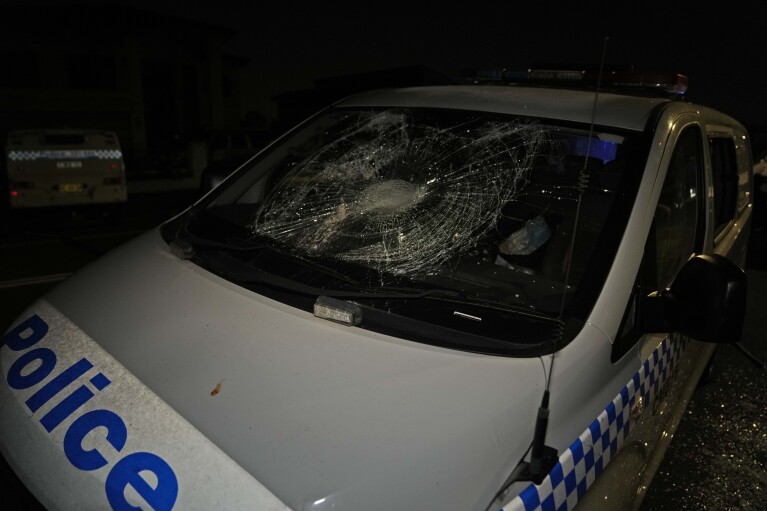 A police car is seen vandalized outside a church where a bishop and churchgoers were reportedly stabbed in Sydney, Australia, Monday, April 15, 2024. (AP Photo/Mark Baker)