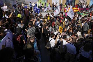 Demonstrators attend a protest at the COP27 U.N. Climate Summit, Saturday, Nov. 12, 2022, in Sharm el-Sheikh, Egypt. (AP Photo/Peter Dejong)
