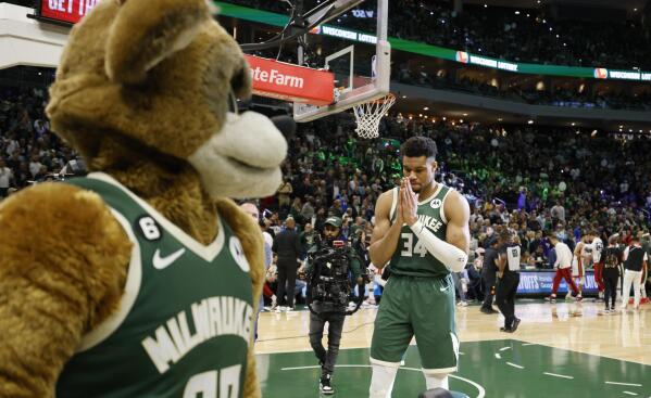 Milwaukee Bucks forward Giannis Antetokounmpo (34) reacts on the floor at the start of the first half of Game 5 in a first-round NBA basketball playoff series Wednesday, April 26, 2023, in Milwaukee. (AP Photo/Jeffrey Phelps)