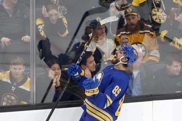Buffalo Sabres right wing Alex Tuch (89) celebrates after scoring the game-winning goal during the overtime period of an NHL hockey game against the Boston Bruins, Saturday, Dec. 31, 2022, in Boston. (AP Photo/Mary Schwalm)