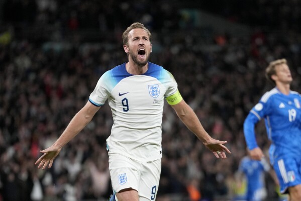 FILE -England's Harry Kane celebrates after scoring his side's third goal during the Euro 2024 group C qualifying soccer match between England and Italy at Wembley stadium in London, Tuesday, Oct. 17, 2023. With four of the hottest forwards in European soccer, England has no shortage of firepower as it looks to end a near-60-year wait for silverware. (AP Photo/Kirsty Wigglesworth, File)