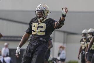 New Orleans Saints defensive end Marcus Davenport (92) stretches during NFL football training camp in Metairie, Friday, July 30, 2021. (AP Photo/Derick Hingle)