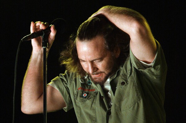FILE - Pearl Jam lead singer Eddie Vedder performs at the Bonnaroo music festival in Manchester, Tenn., June 14, 2008. In 1994 Pearl Jam filed a complaint against Ticketmaster with the Justice Department, claiming that the company used its position in the industry to stop promoters from booking the band because they railed against Ticketmaster's pricing. (AP Photo/Mark Humphrey, File)