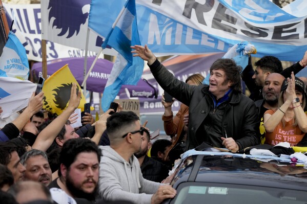 Presidential hopeful of the Liberty Advances coalition Javier Milei, waves at followers during a campaign event in La Plata, Argentina, Tuesday, Sept. 12, 2023. General elections in Argentina are set for Oct. 22. (AP Photo/Natacha Pisarenko)