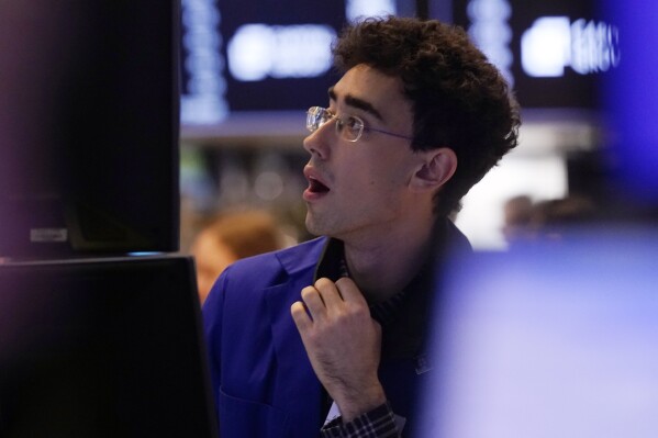 Specialist Alexander Weitzman work on the floor of the New York Stock Exchange, Tuesday, March 11, 2025. (AP Photo/Richard Drew)