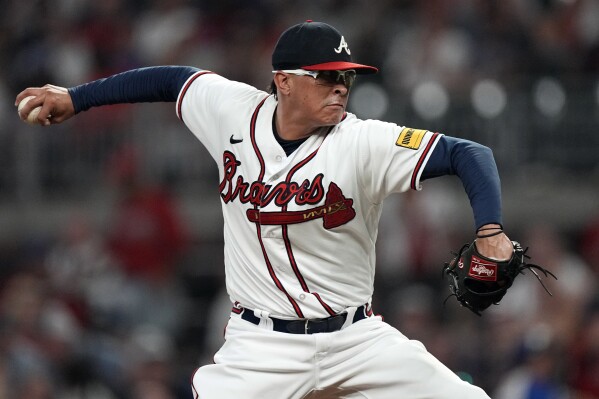 FILE - Atlanta Braves relief pitcher Jesse Chavez works against the New York Mets during the eighth inning of a baseball game Tuesday, June 6, 2023, in Atlanta. The Braves signed veteran right-hander Jesse Chavez to a minor league contract on Monday, March 25, 2024, providing the opportunity for the reliever's fifth stint with the team. Chavez, 40, was released by the Chicago White Sox on Saturday. (AP Photo/John Bazemore, File)