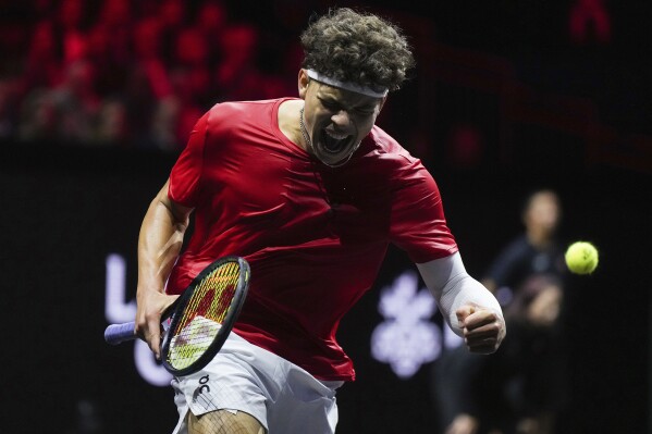 Team World's Ben Shelton celebrates after winning a game against Team Europe's Arthur Fils during the second set of a Laver Cup tennis singles match in Vancouver, British Columbia, Friday, Sept. 22, 2023. (Darryl Dyck/The Canadian Press via AP)