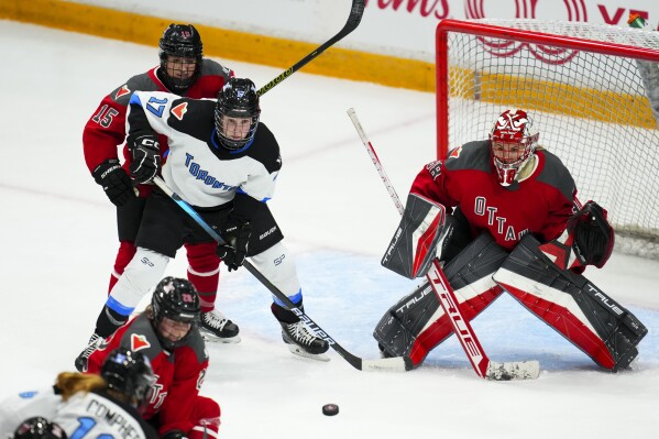 Ottawa's goaltender Emerance Maschmeyer (38) keeps her eye on the puck as she takes on Toronto during the third period of a PWHL hockey game Tuesday, Jan. 23, 2024, in Ottawa, Ontario. (Sean Kilpatrick/The Canadian Press via AP)