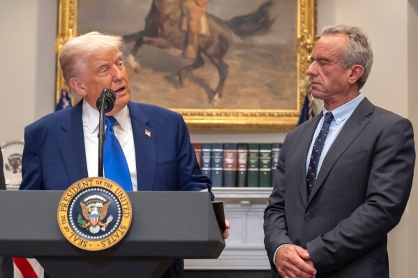 President Donald Trump, from left, speaks as Health and Human Services Secretary Robert F. Kennedy Jr., during an event in the Roosevelt Room at the White House, May 12, 2025, in Washington. (AP Photo/Mark Schiefelbein, File)\\\