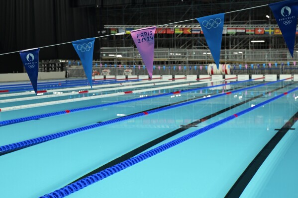 The swimming pool for Olympic competitions is seen in the Paris La Defense Arena in Nanterre, outside Paris, Monday July 5, 2024. The Paris La Defense Arena will host the swimming and some water polo events during the Paris 2024 Olympic Games. (Bertrand Guay/ Pool via AP)