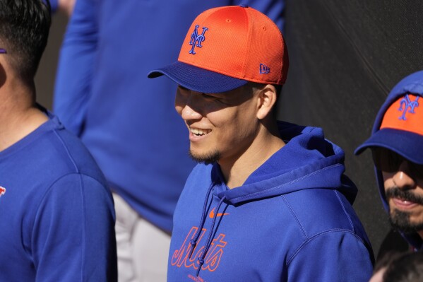 New York Mets pitcher Kodai Senga smiles during a spring training baseball workout Tuesday, Feb. 20, 2024, in Port St. Lucie, Fla. (AP Photo/Jeff Roberson)