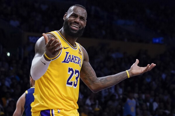 Los Angeles Lakers forward LeBron James reacts during the second half of the team's NBA basketball game against the Golden State Warriors, Tuesday, April 9, 2024, in Los Angeles. (AP Photo/Ryan Sun)
