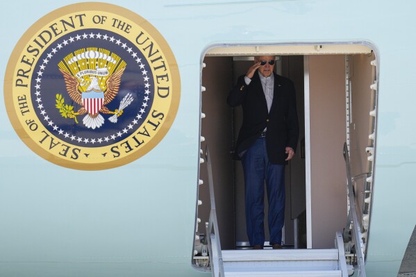 President Joe Biden salutes as he boards Air Force One at Andrews Air Force Base, Md., Wednesday, Nov. 1, 2023, en route to Minneapolis. (AP Photo/Jess Rapfogel)