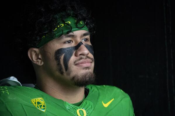 FILE - Oregon linebacker Noah Sewell (1) waits to enter the field before an NCAA college football game in Eugene, Ore., Saturday, Nov. 27, 2021. The 2021 season was filled with surprising contenders and conference champions. Another season with that much volatility in 2022 seems unlikely. (AP Photo/Andy Nelson, File)