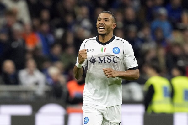 Napoli's Juan Jesus, center, celebrates after scoring his side's first goal during the Serie A soccer match between Inter Milan and Napoli at the San Siro Stadium, in Milan, Italy, Sunday, March 17, 2024. (AP Photo/Antonio Calanni)