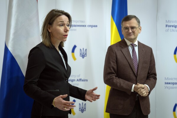 Foreign Minister Hanke Bruins Slot of the Netherlands, left, and Ukrainian Foreign Minister Dmytro Kuleba attend a joint news conference following their talks in Kyiv, Ukraine, Tuesday, Dec. 5, 2023. (AP Photo/Efrem Lukatsky)