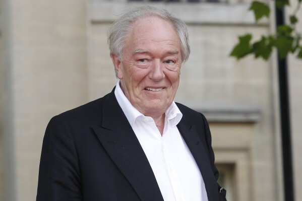 FILE - British actor Michael Gambon arrives in Trafalgar Square, in central London, for the world premiere of "Harry Potter and The Deathly Hallows: Part 2," the last film in the series, on July 7, 2011. Gambon, who was known to many for his portrayal of Hogwarts headmaster Albus Dumbledore in six of eight “Harry Potter” films, died. He was 82. A statement by his family, issued by his publicist on Thursday, Sept. 28, 2023, said he died following “a bout of pneumonia.” (AP Photo/Joel Ryan, File)