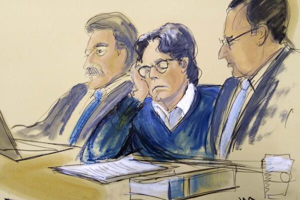 FILE - In this June 18, 2019, file courtroom artist's sketch, defendant Keith Raniere, center, sits with attorneys Paul DerOhannesian, left, and Marc Agnifilo during closing arguments at Brooklyn federal court in New York. Raniere, the former leader of the cult-like NXIVM group, has been ordered to pay $3.5 million to 21 victims of a sex-trafficking scheme. (Elizabeth Williams via AP, File)