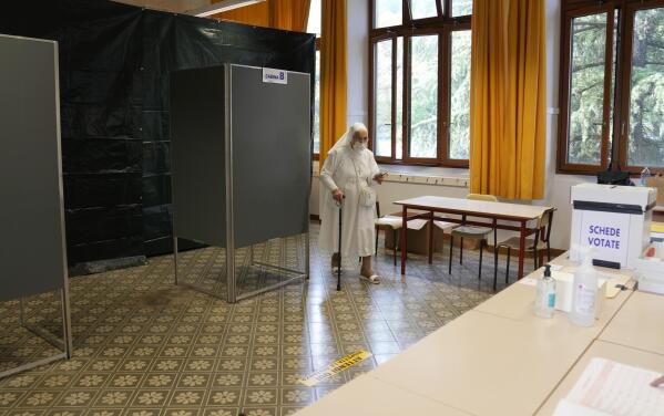 A nun holds her ballot after voting for the abortion referendum at a polling station in San Marino, Sunday, Sept. 26, 2021. Tiny San Marino is one of the last countries in Europe which forbids abortion in any circumstance — a ban that dates from 1865. Its citizens are voting Sunday in a referendum calling for abortion to be made legal in the first 12 weeks of pregnancy. (AP Photo/Antonio Calanni)