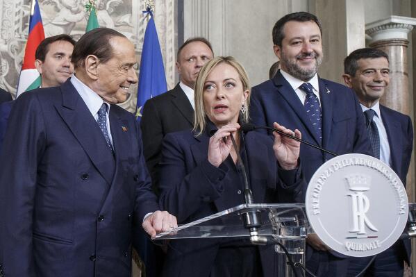 Brothers of Italy's leader Giorgia Meloni, center, flanked by Forza Italia's leader Silvio Berlusconi, left, and The League's leader Matteo Salvini, speaks to the press at the Quirinale Presidential Palace after talks with Italian President Sergio Mattarella, Friday, Oct. 21, 2022, who will appoint a new Italian premier after Sept. 25 political elections. (Roberto Monaldo/LaPresse via AP)