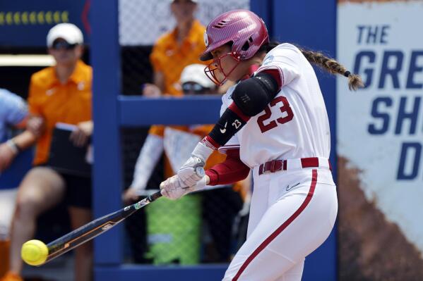 Oklahoma's Tiare Jennings hits a single against Tennessee during the first inning of an NCAA softball Women's College World Series game Saturday, June 3, 2023, in Oklahoma City. (AP Photo/Nate Billings)