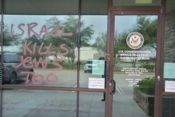 This undated photo released by the Office of Congresswoman Monica de la Cruz shows recent vandalism on the front of her McAllen, Texas, office. Her office was vandalized this week on Nov. 7 and 9, 2023. (Office of Congresswoman Monica de la Cruz via AP)