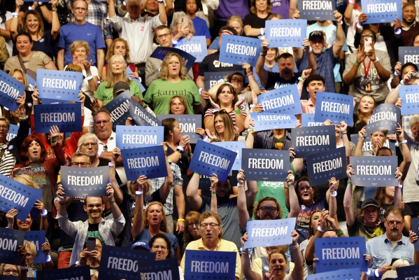 FILE - Supporters listen as Minnesota Gov. Tim Walz speaks during a campaign rally in Milwaukee, Aug. 20, 2024. (AP Photo/Jeffrey Phelps, File)