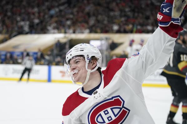 Montreal Canadiens right wing Cole Caufield celebrates after the goal by teammate Tyler Toffoli during the first period in Game 2 of an NHL hockey Stanley Cup semifinal playoff series against the Vegas Golden Knights, Wednesday, June 16, 2021, in Las Vegas. Caufield assisted on the scoring play. (AP Photo/John Locher)