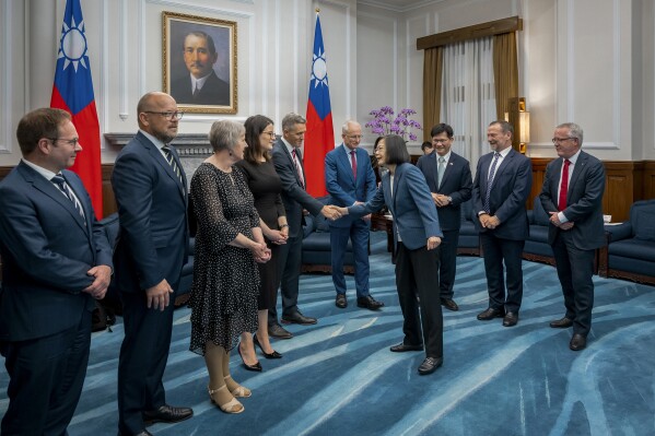 FILE - In this photo released by the Taiwan Presidential Office, visiting Australian lawmakers is greeted by Taiwan's President Tsai Ing-wen at the Presidential Office in Taipei, Taiwan on Tuesday, Sept. 26, 2023. The Chinese government on Wednesday, Sept. 27, accused Taiwan's ruling party of seeking independence, a day after the self-governing island's president lobbied for Australia's support in joining a regional trade pact. (Taiwan Presidential Office via AP, File)