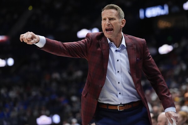 Alabama head coach Nate Oats yells at an official during the first half of an NCAA college basketball game against Florida at the Southeastern Conference tournament Friday, March 15, 2024, in Nashville, Tenn. (AP Photo/John Bazemore)