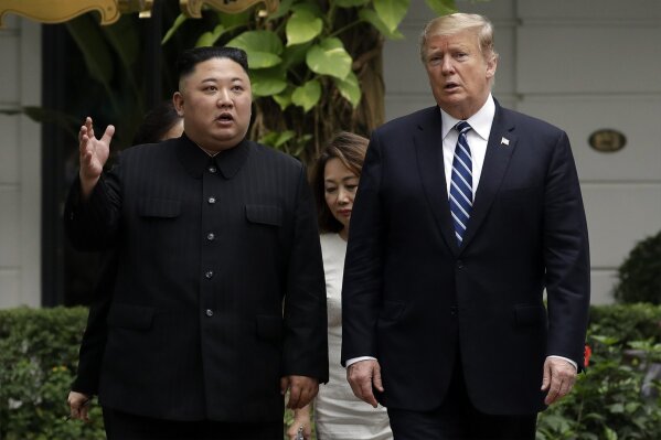 FILE - In this Feb. 28, 2019, file photo, U.S. President Donald Trump, right, and North Korean leader Kim Jong Un take a walk after their first meeting at the Sofitel Legend Metropole Hanoi hotel in Hanoi, Vietnam. North Korea on Saturday, June 13, 2020 again bashed South Korea, telling its rival to stop “nonsensical” talk about its denuclearization and vowing to expand its military capabilities. (AP Photo/Evan Vucci, File)