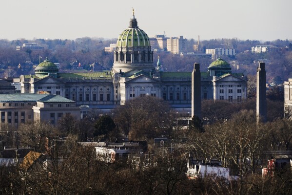 FILE - The Pennsylvania Capitol is seen, Dec. 16, 2021, in Harrisburg, Pa. A bill passed the GOP-controlled state Senate to require Pennsylvania parents to opt in their children to access book deemed sexually explicit after more than an hour of passionate floor debate Tuesday, Oct. 24, 2023. (AP Photo/Matt Rourke, File)