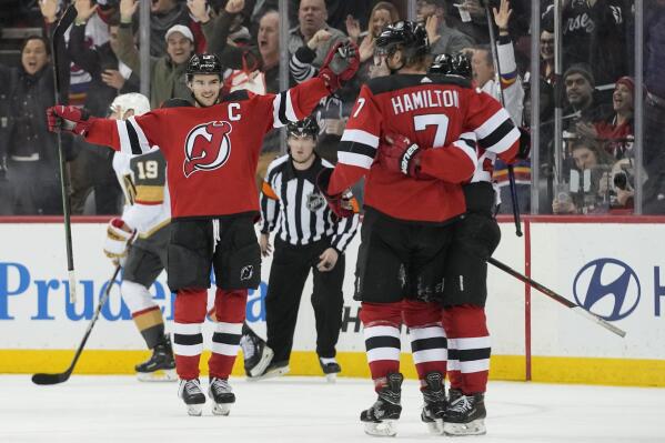 New Jersey Devils defenseman Dougie Hamilton (7) celebrates with his teammates after scoring against the Vegas Golden Knights in the third period of an NHL hockey game, Tuesday, Jan. 24, 2023, in Newark, N.J. The Devils won 3-2. (AP Photo/Mary Altaffer)