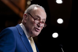 Senate Majority Leader Chuck Schumer, D-N.Y., speaks to at the Capitol in Washington, Tuesday, Feb. 13, 2024. Schumer says Democrats plan to "constantly over the next year" remind voters that it was Donald Trump, the likely Republican presidential nominee, who torpedoed a bipartisan bill on border enforcement. (AP Photo/J. Scott Applewhite)