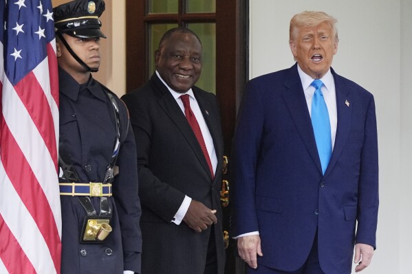 President Donald Trump greets South African President Cyril Ramaphosa at the White House, Wednesday, May 21, 2025, in Washington. (AP Photo/Julia Demaree Nikhinson)