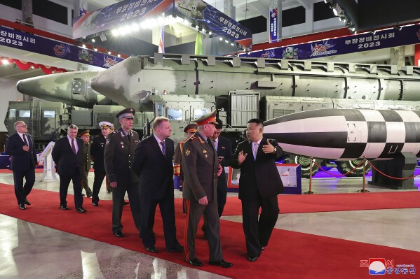 In this photo provided by the North Korean government, North Korean leader Kim Jong Un, right, with Russian delegation led by its Defense Minister Sergei Shoigu visits an arms exhibition in Pyongyang, North Korea Wednesday, July 26, 2023, on the occasion of the 70th anniversary of the armistice that halted fighting in the 1950-53 Korean War. Independent journalists were not given access to cover the event depicted in this image distributed by the North Korean government. The content of this image is as provided and cannot be independently verified. Korean language watermark on image as provided by source reads: 