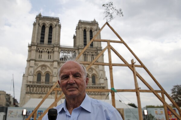 FILE - General Jean-Louis Georgelin who is to oversee reconstruction of Notre Dame Cathedral, attends an interview in front of Notre Dame Cathedral in Paris, France, Saturday, Sept. 19, 2020. The decorated French general in charge of big-budget restoration work on fire-ravaged Notre Dame Cathedral in Paris has died on Saturday, Aug. 19, 2023. Jean-Louis Georgelin was 74. (AP Photo/Francois Mori, File)