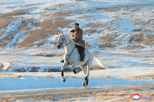FILE - In this photo provided on Oct. 16, 2019, by the North Korean government, North Korean leader Kim Jong Un rides a white horse to climb Mount Paektu, North Korea. Russia recently sent North Korean leader Kim Jong Un a trainload of 30 thoroughbred horses, opening the border with its neighbor for the first time in 2 1/2 years. The content of this image is as provided and cannot be independently verified. Korean language watermark on image as provided by source reads: "KCNA" which is the abbreviation for Korean Central News Agency. (Korean Central News Agency/Korea News Service via AP, File)
