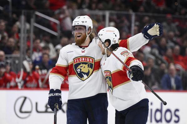Florida Panthers defenseman Marc Staal, left, celebrates his goal against the Washington Capitals with defenseman Brandon Montour during the second period of an NHL hockey game Thursday, Feb. 16, 2023, in Washington. (AP Photo/Nick Wass)