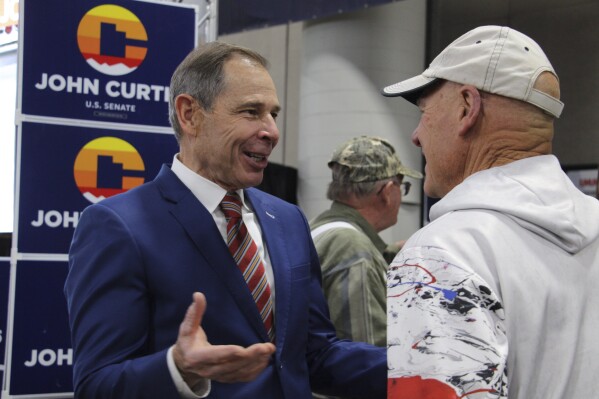U.S. Rep. John Curtis, a candidate for the U.S. Senate seat Mitt Romney is vacating, speaks to delegates at the Utah Republican Party Convention, April 27, 2024, at the Salt Palace Convention Center in Salt Lake City, Utah. (AP Photo/Hannah Schoenbaum)