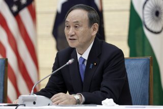 Japan's Prime Minister Yoshihide Suga speaks during the virtual summit of the leaders of Australia, India, Japan and the U.S., a group known as “the Quad", at his official residence in Tokyo, Japan, on Friday, March 12, 2021. (Kiyoshi Ota/Pool via AP)