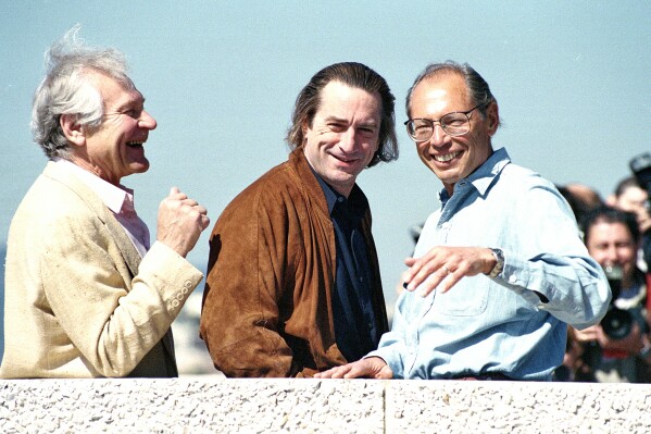  De Niro appears with fellow actor Sam Wanamaker, left, and director Irwin Winkler at Cannes in 1991, where they premiered "Guilty by Suspicion." (AP Photo/Gilbert Tourte)
