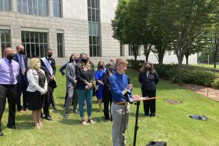 FILE - Dylan Brandt speaks at a news conference outside the federal courthouse in Little Rock, Ark., July 21, 2021. Brandt, a teenager, is among several transgender youth and families who are plaintiffs challenging a state law banning gender confirming care for trans minors. The nation's first trial on a ban on gender affirming care for children ended on Thursday, Dec. 1, 2022, as Arkansas wrapped up its case defending the prohibition with testimony from an endocrinologist opposed to such treatments for minors. (AP Photo/Andrew DeMillo, File)